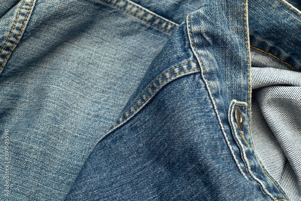 Blue denim texture with a rivet