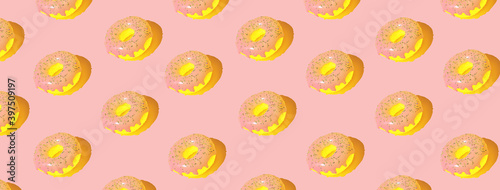 Pink glazed donut pattern on pastel background. Creative concept. 3d.