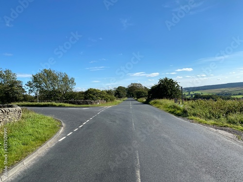 Intersection of, Meagill Lane, with Hardisty Hill, on a hot summers day in, Blubberhouses, Harrogate, UK photo