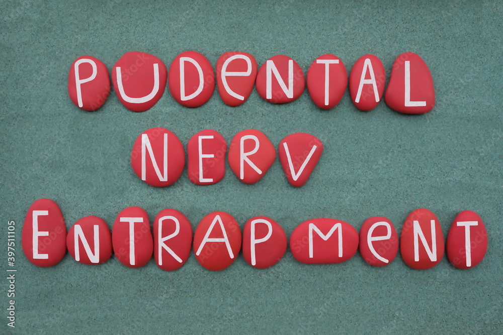 Pudendal nerve entrapment, illness name composed with red colored stone letters over green sand