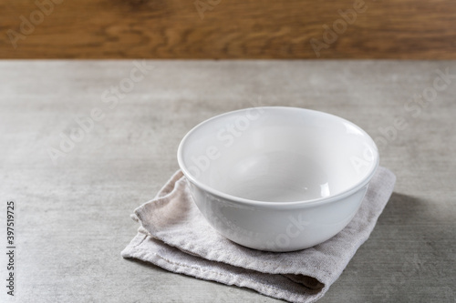 white empty pot bowl to put fruits or ice cream on a wooden table background. copy space