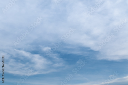 White Cirrostratus clouds on blue sky in sunny day.