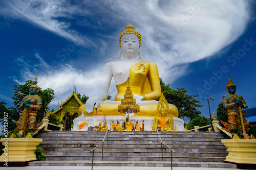 Buddha statue at Wat Phra That Doi Kham in Chiang Mai thailand. © nopporn
