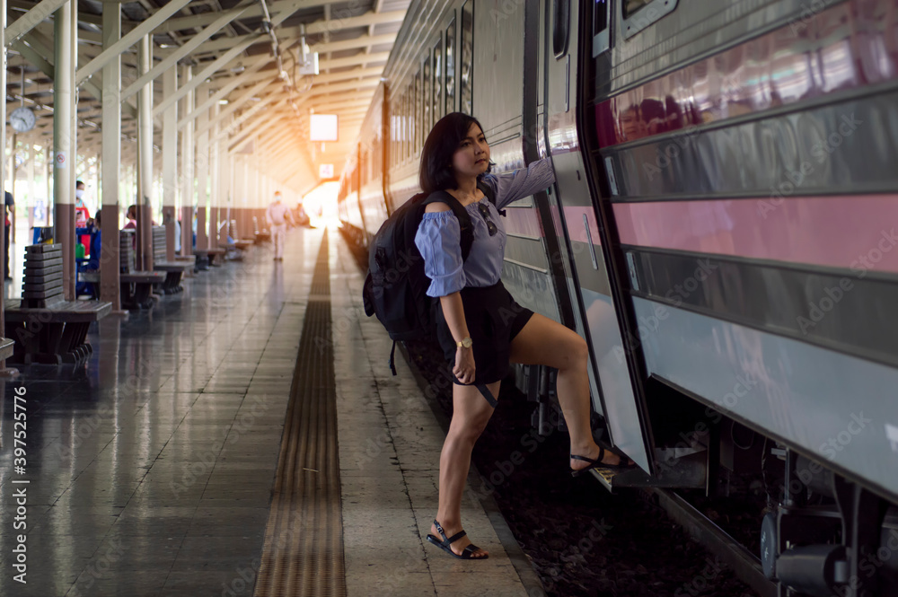 Female tourists taking the train, travel concept