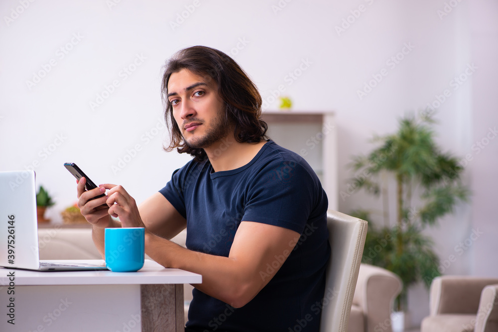 Young man employee working from house Young man employee working from house