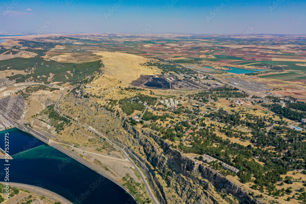 A river from the lake of Ataturk Dam at Anatolia.Biggest river in Turkey for agricultural using.The drone shots of the river on a sunny day.