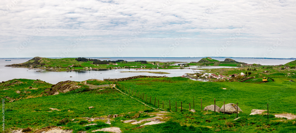 Green landscape of three islands in Rennesoy commune: Fjoloy, Klosteroy and Mosteroy from a track to Mastravarden hill, Norway, May 2018