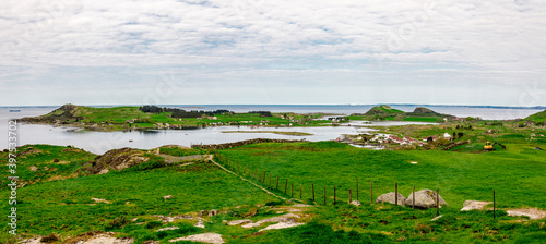 Obraz na płótnie Green landscape of three islands in Rennesoy commune: Fjoloy, Klosteroy and Mosteroy from a track to Mastravarden hill, Norway, May 2018 w salonie