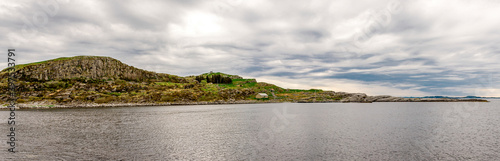 Obraz na płótnie A panoramic view to Fjoloy island coastline from the lighthouse point, Rennesoy kommune, Stavanger, Norway, May 2018 w salonie