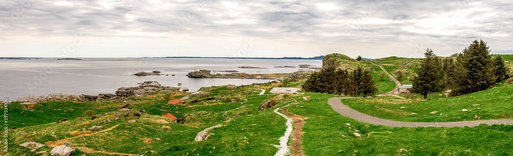 Panorama of Fjoloy island landscape with footpath around fortress remains site, Rennesoy kommune, Stavanger, Norway, May 2018