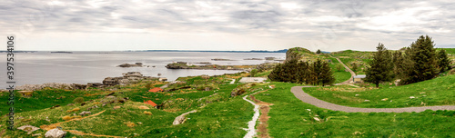 Obraz na płótnie Panorama of Fjoloy island landscape with footpath around fortress remains site, Rennesoy kommune, Stavanger, Norway, May 2018 w salonie