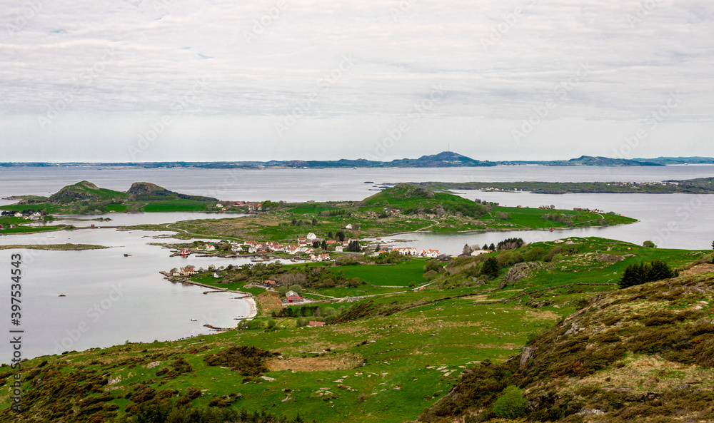 A view to a small village on Klosteroy island from top of Mastravarden hill on Mosteroy, Rennesoy kommune, Norway, May 2018