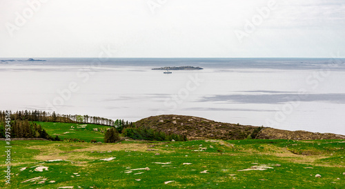 Obraz na płótnie A view to the ferry from Kvitsoy island from Mastravarden hill on Mosteroy, Rennesoy kommune, Norway, May 2018 w salonie