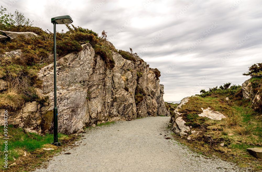 A lightpost on a footpath at the entrance to historical Fjoloy fort, Rennesoy kommune, Stavanger, Norway, May 2018