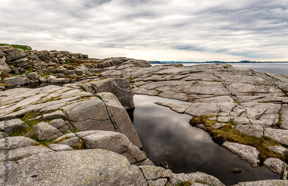 Scenic rocky coastline near Fjoloy fort historical site, Rennesoy kommune, Stavanger, Norway, May 2018