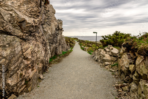 Obraz na płótnie A long footpath leading to remains of the historical Fjoloy fort site, Rennesoy kommune, Stavanger, Norway, May 2018 w salonie