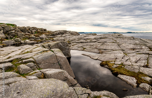 Scenic rocky coastline near Fjoloy fort historical site, Rennesoy kommune, Stavanger, Norway, May 2018