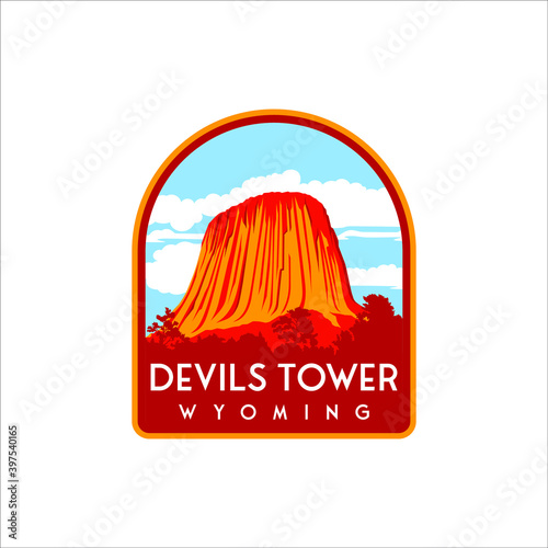 Devils Tower with retro designs and badges