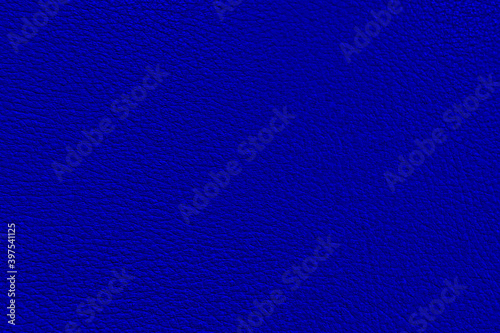 The texture of perforated leather. An empty colored surface. Blank for a design or template for a website. Abstract blue background