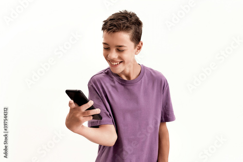 Obraz na plátně Teenaged disabled boy with cerebral palsy looking happy while holding and using