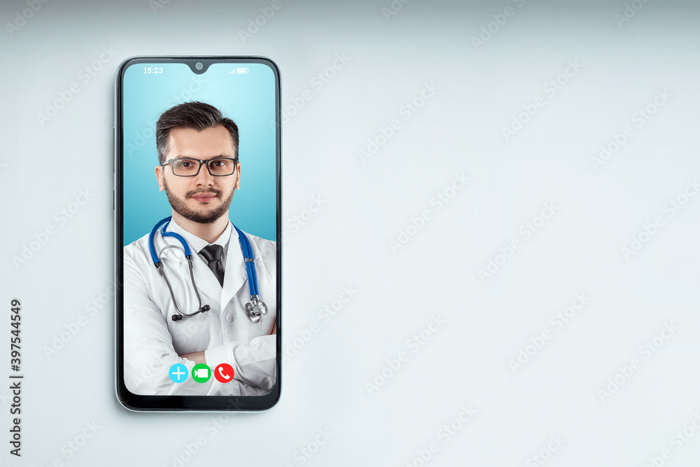 Portrait of a man, a doctor on a smartphone screen, a video conference, an appointment with a doctor online. Medical technology concept, the future of medicine. Mixed media. Portrait of a man, a doctor on a smartphone screen, a video conference, an appointment with a doctor online. Medical technology concept, the future of medicine. Mixed media.