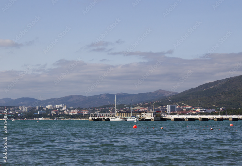 View of the city by the sea and mountains