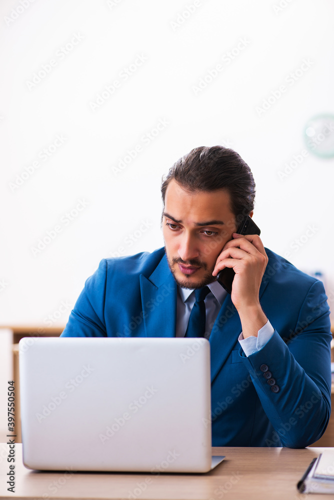 Young male employee and too many work in the office Young male employee and too many work in the office