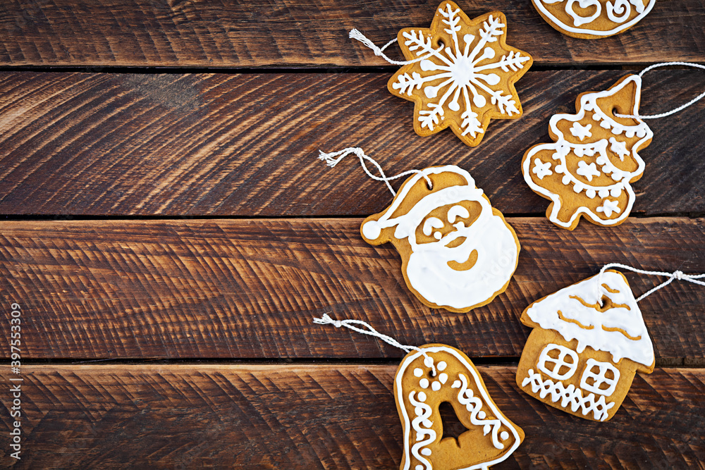 Christmas homemade gingerbread cookies on wooden background. Top view