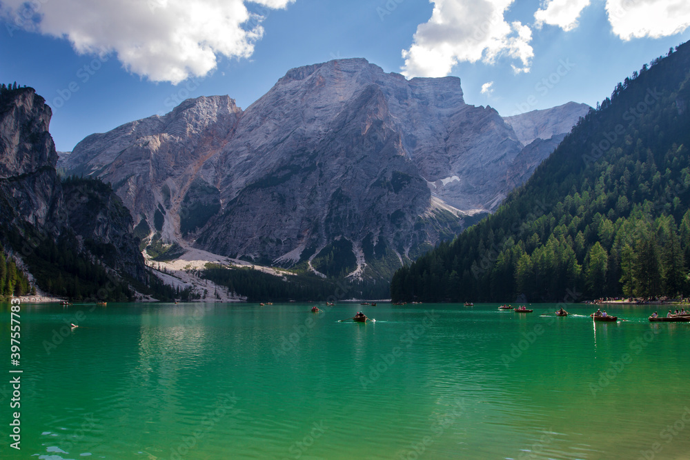 Reflections in the Braies lake in the Dolomites mountains