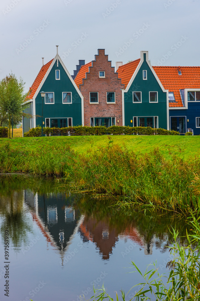 Volendam is a town in North Holland in the Netherlands. Colored houses of marine park in Volendam. Volendam is a town in North Holland in the Netherlands. Colored houses of marine park in Volendam.