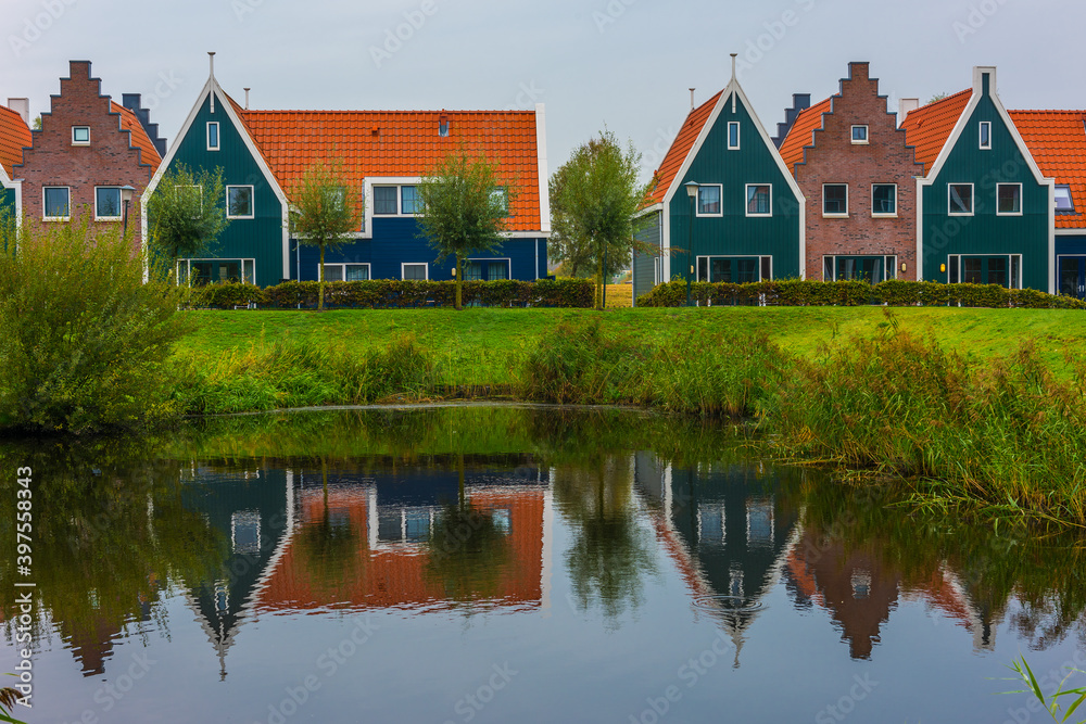 Volendam is a town in North Holland in the Netherlands. Colored houses of marine park in Volendam. Volendam is a town in North Holland in the Netherlands. Colored houses of marine park in Volendam.