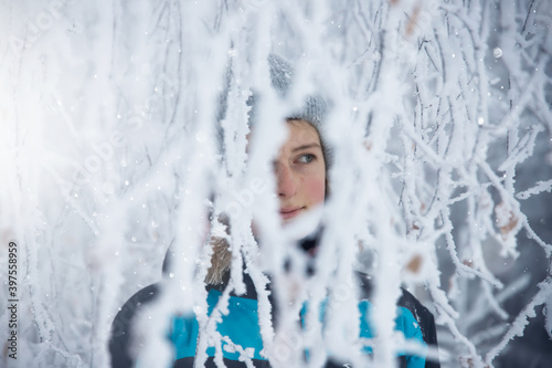 Fototapeta Naklejka Na Ścianę i Meble -  Young girl in fairytale winter landscape.