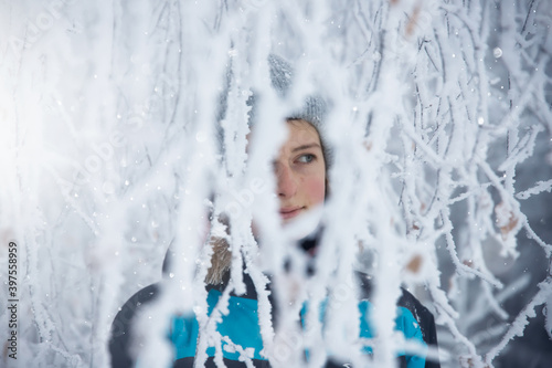 Young girl in fairytale winter landscape.