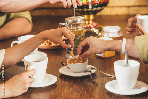 Friends drink herbal tea after spa treatments in the sauna. Concept - healthy lifestyle