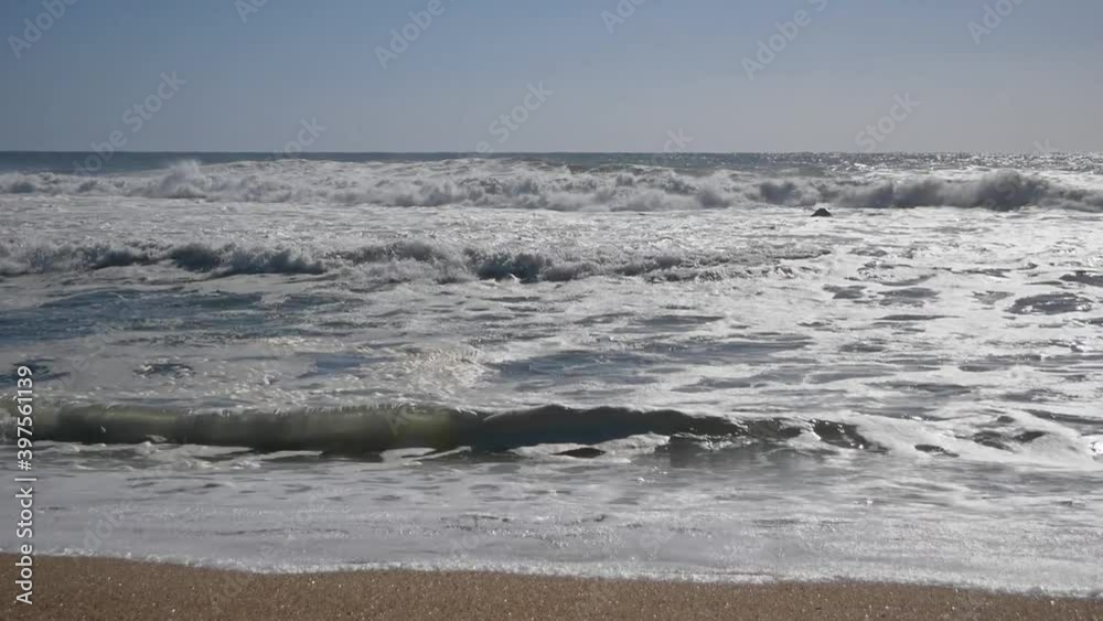 Storm on the Sea. Huge Waves are Crashing and Spraying on the Shore. Slow Motion Storm on the Sea. Huge Waves are Crashing and Spraying on the Shore. Slow Motion
