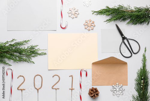 Beautiful New Year composition with blank card and envelope on white background