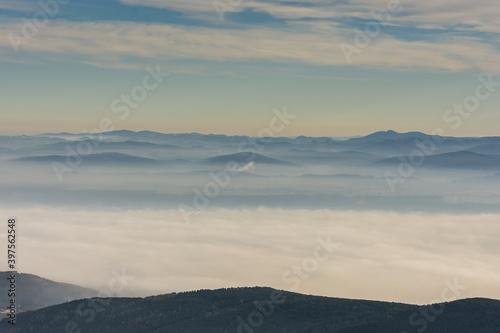 mountain landscape with dense ground fog and clouds