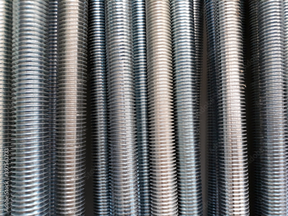 A number of threaded steel rods, may be used as background A number of threaded steel rods, may be used as background