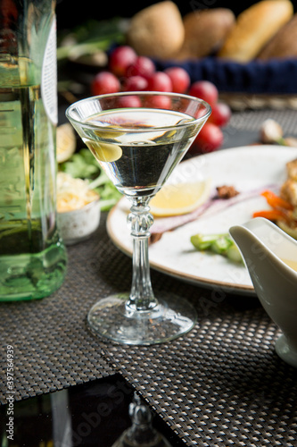 Martini glass with a bottle. Snacks for vermouth. Snacks for Martini.