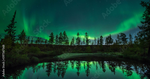 Northern lights reflected in the water