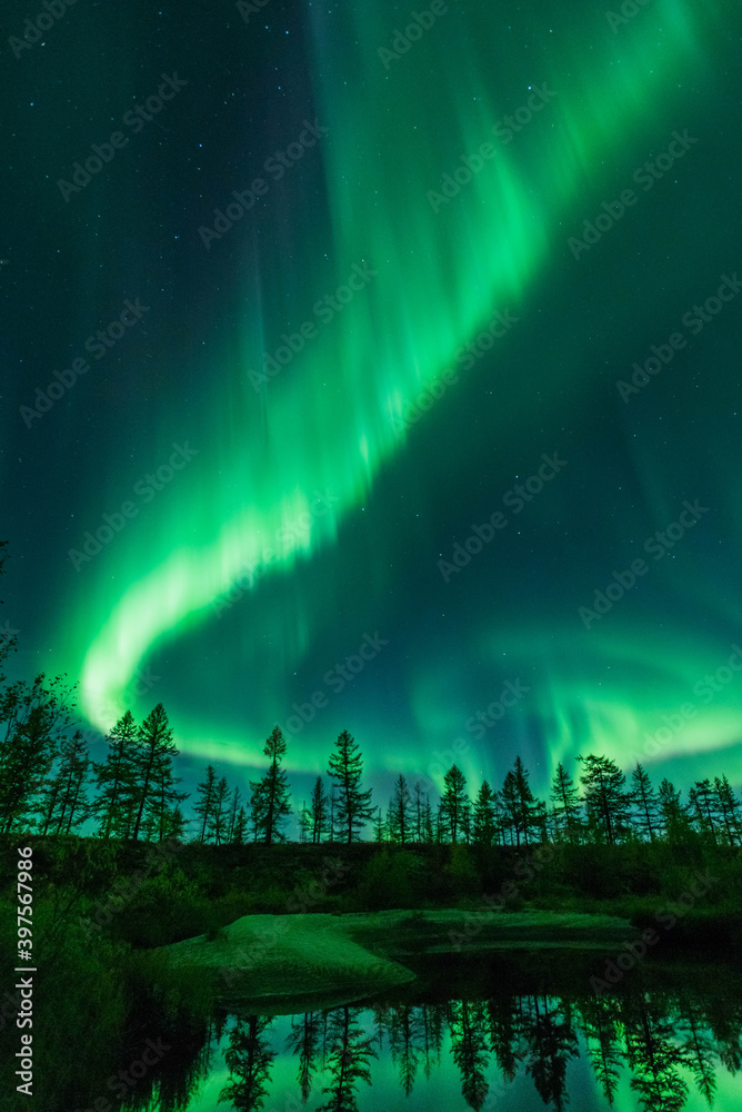 Northern lights reflected in the water