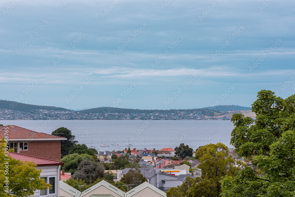 Water view across rooftops in Sandy Bay, Tasmania