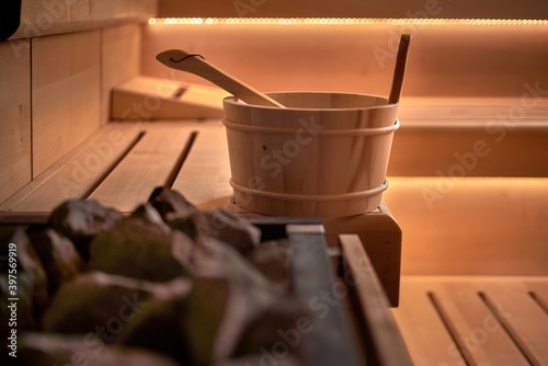 Sauna bucket in hot cosy sauna room - no people. photo