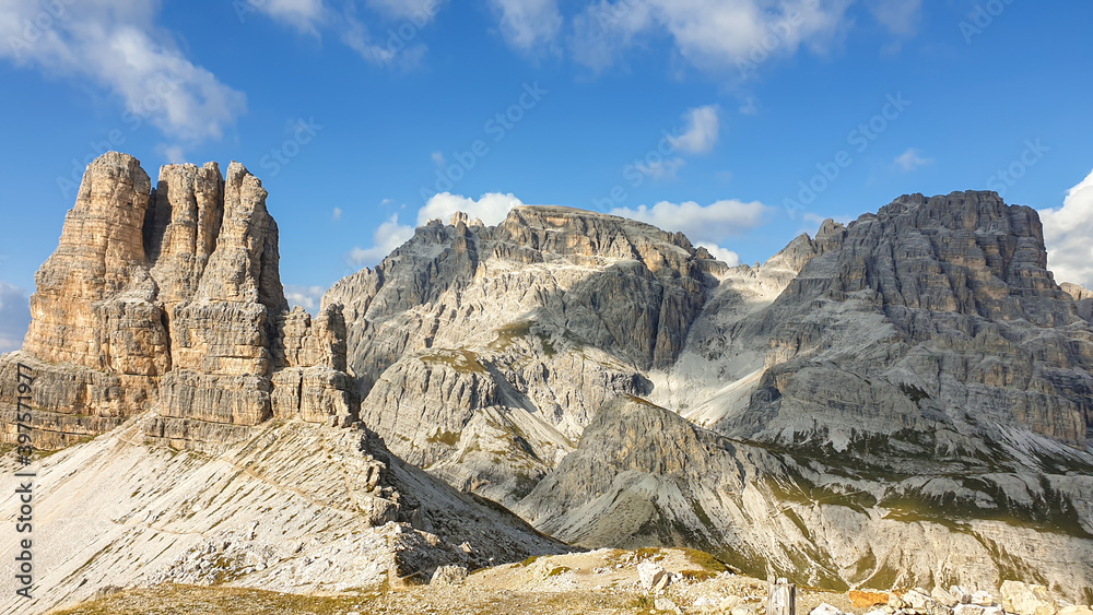 A panoramic view on Toblinger Knoten and surrounding mountains in Italian Dolomites. Difficult ad dangerous climbing route. Stony valley below. Few narrow pathways on the side. Freedom and serenity A panoramic view on Toblinger Knoten and surrounding mountains in Italian Dolomites. Difficult ad dangerous climbing route. Stony valley below. Few narrow pathways on the side. Freedom and serenity