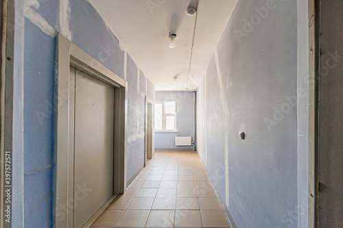 Russia, Moscow- April 17, 2020: interior public place, house entrance. doors, walls, staircase corridors © evgeniykleymenov