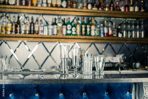 empty cocktail glasses at the bar