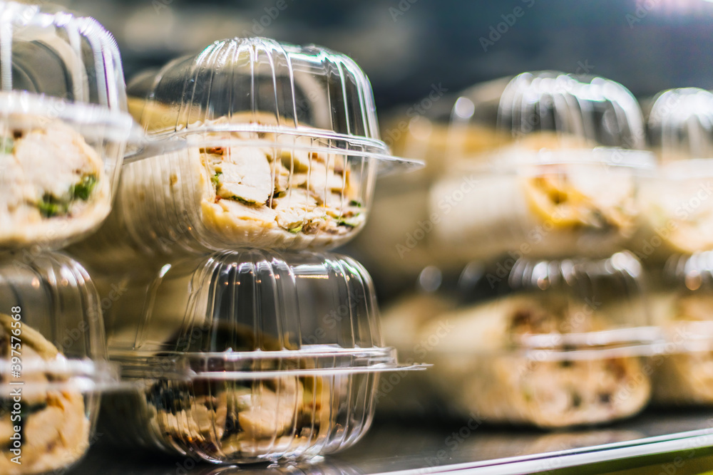 Pre-packaged sandwiches put up for sale in a commercial fridge Pre-packaged sandwiches put up for sale in a commercial fridge