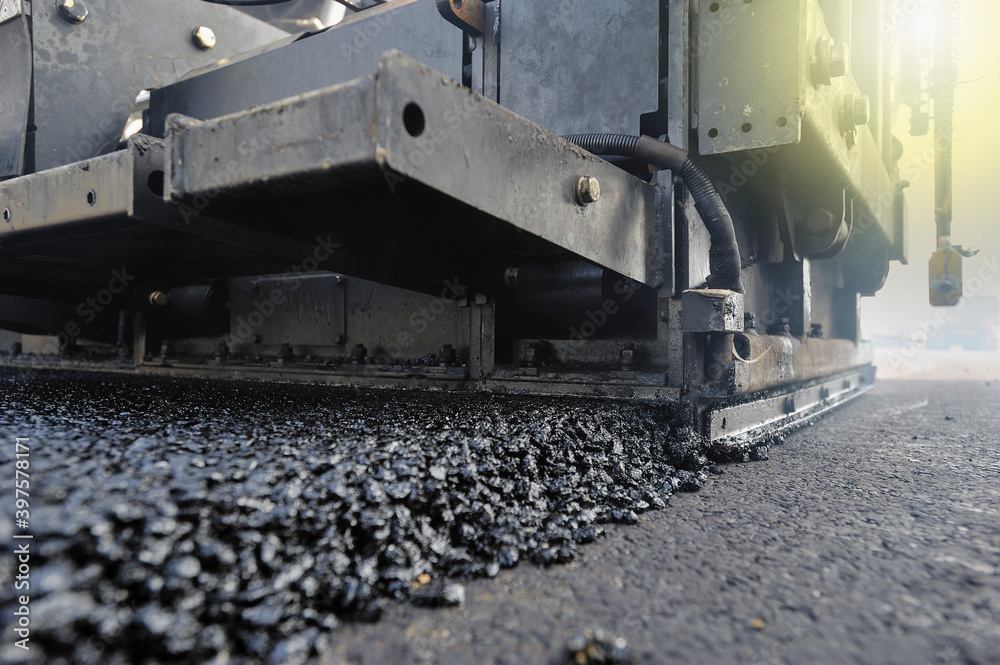 View of bitumen activity to repair  a road