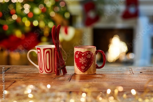 Canvas Print Christmas still life with mugs and fireplace - cosy winter time.