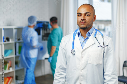 Portrait of african american doctor, hospital background
